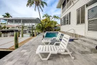Tropical Oasis Pool Kayak Bikes fish from dock