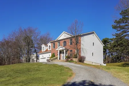 Spacious 6-bedroom Pocono Home with Hot Tub, Game and Theater rooms, Fire Pit!