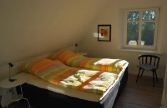 Cottage on park-like grounds with pond