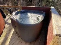 Elevated eclectic yurt with wrap-around porch, hot tub, and mountain view! Hotels in Piper Gap