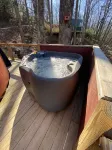 Elevated eclectic yurt with wrap-around porch, hot tub, and mountain view!