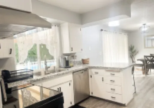 Beautiful Home in quiet neighborhood with a pool and close to stores & highways.