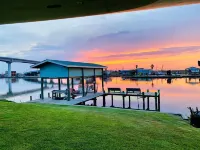 Beautiful beach house boasts a scenic water view from its front and back doors.
