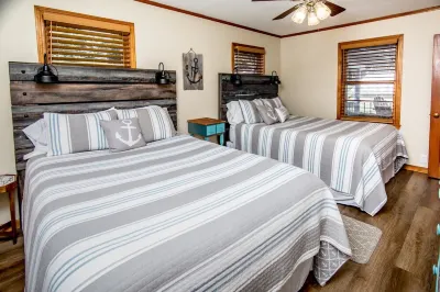 Relax by Lake of the Ozarks in your spacious Sunrise Beach retreat on 1 acre.