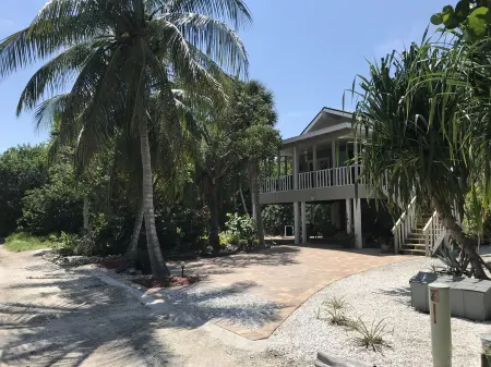 Romantic beach home with golf cart Remodeled Coastal charm
