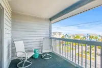 Beautiful home across from beach with pool, central AC, balcony & washer/dryer
