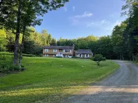Spacious five-bedroom home off Back Lake with direct trail access on Spooner Rd