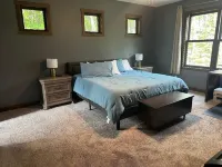 BEAUTIFUL lake front home with a private beach, dock and large yard