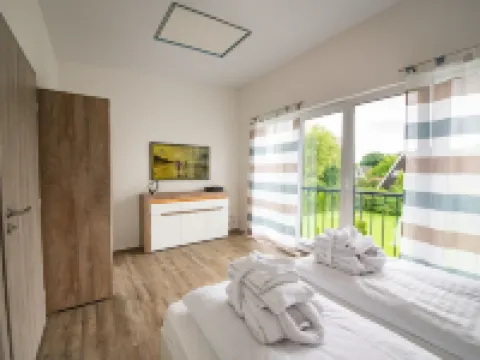 Ferienhaus in Damp am Ostseestrand Hotéis em Damp