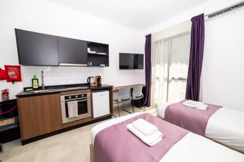 Comfy 2 Single Bed Studio Apartment by HostMT - 2-Star