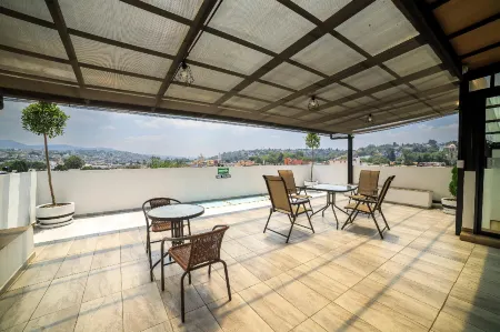 Capital O Hotel Boutique Las Torres Отели в г. Сан Себастьян Атлаапа