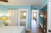 Peek of the ocean King size bed just Steps from the Beach