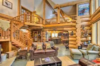 Luxury Riverfront Log Cabin Near Stevens Pass with Hot Tub & Two-Story Fireplace