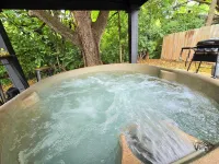 Lux Couples Retreat: Hot Tub & Sleep Number Bed Hotels in Johnson