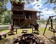 Riverfront Log Cabin with Hot Tub-Tubing on the River, Pet Friendly.