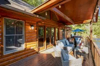 Waterfront Cabin with Hot Tub and Outdoor Fun - Cozy River Retreat