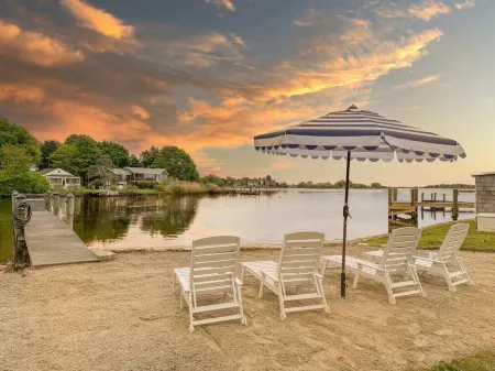 Stunning waterfront home with big yard & dock! Voted #1 rental in all of RI!