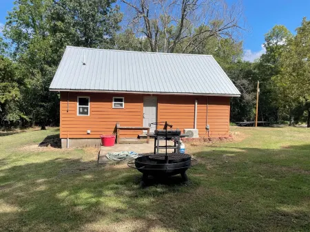 House on 80 acres that connect into the off road park! Extra cabins available.