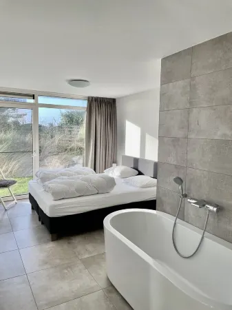 Luxury 8 person 'Golf Villa Texel' near the sea