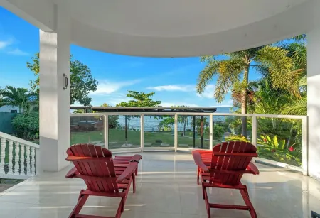 Breathtaking Villa with ocean views, hot tub, BBQ, and steps from the beach