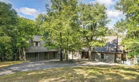 Very private 4 bd lake house with man-cave, guest house, hot tub, gym, grill