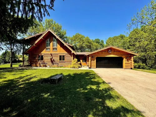 Gorgeous XL Log Cabin in Bloomington, IL! 2 Game Rooms + Hot Tub & Sauna!