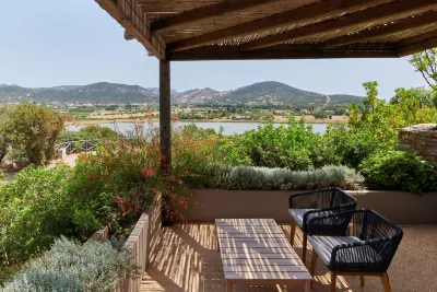 Baia Chia Laguna Resort, Curio Collection by Hilton Hotel di 