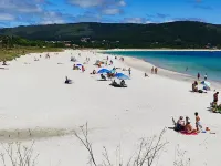 The apartment is located in front of Langosteira beach, with stunning views.