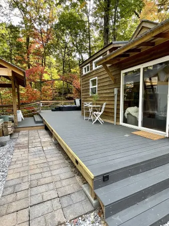 Luxury Tiny House with Treehouse Bedroom and HotTub on 34acres secluded