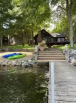 Whitefish Chain Lake Home with Beach + Sauna + King Beds + Kayaks +Paddle Boards