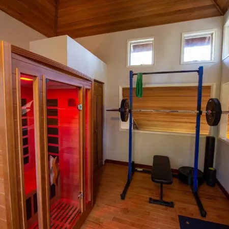 Tranquil Forested Cabin with Sauna, Home Gym, & AC