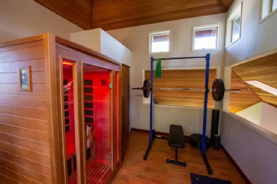 Tranquil Forested Cabin with Sauna, Home Gym, & AC