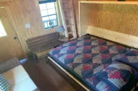 Big Mike's Cabin on the lake, next to ball diamonds nestled in 3 -cabin village