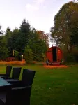 Spacious vacation apartment with fireplace and barrel sauna in the sheltered garden.