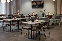 于默奧城市凱富酒店 - 早餐