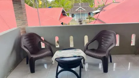 Penginapan Reska Syariah Отели рядом с достопримечательностью «Монумен Пересмиан Бандара Интернашенал Минангкабау»