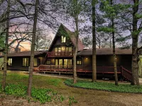 Spacious A-Frame sleeps 25 on 5 wooded acres with a private fishing pond