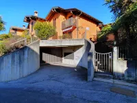 House in Luino with Green Garden and City Views