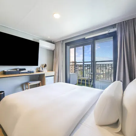 Songtan Hotel Corner Inn Отели рядом с достопримечательностью «Авиа База Осен»