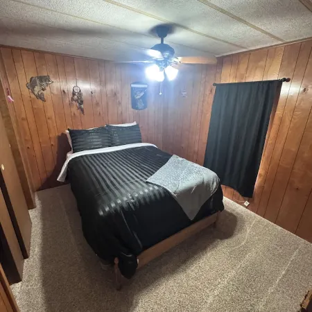 Quiet cabin in the woods w/ access to pools, river, & lakes in gated community!!