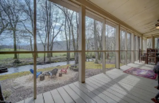 Creekfront Hayesville retreat w/ wrap-around porch and views!