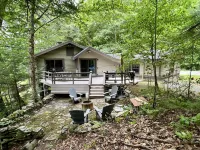 Lakefront cabin with dock, hot tub, fire pit!!