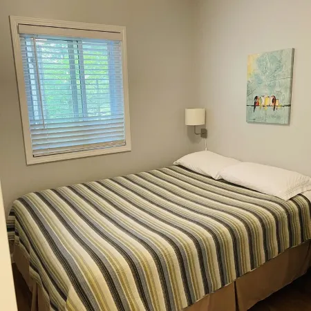 NEWLY RENOVATED! Large sandy beach & swim area. Cute 3 bedroom lake house