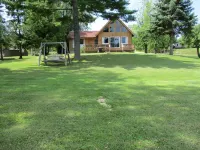Dad's Paradise on Pigeon Cove offers WaterFront Sunrise Views and Lake Access!