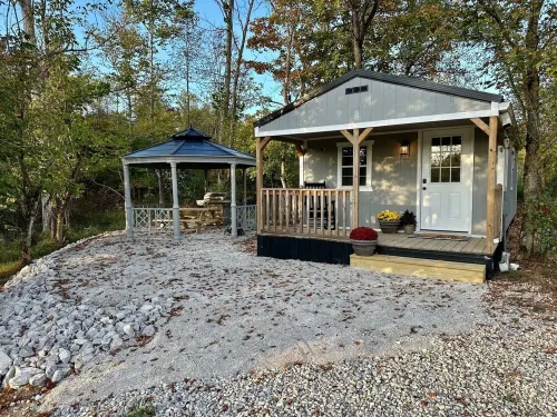 This tiny cabin is a peaceful place complete with stocked pond and kayaks!