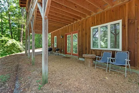 A Laurel Haven, with big porches and a log cabin feel. Fireplace.
