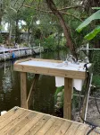 Waterfront Retreat with fenced yard, porch + bar, canal views, NEW DOCK