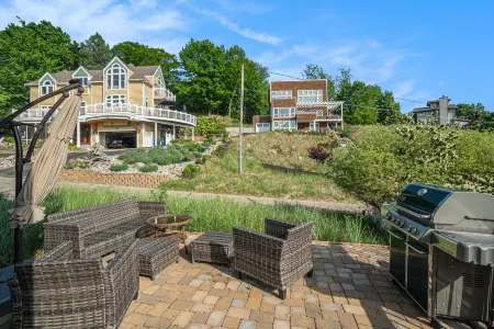 Peek-a-Boo Lake Views and Spacious Deck - Charming Beachside Retreat