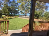 Self contained unit. By the beach and golf course  only 2.2 kms to town centre Hotels in 