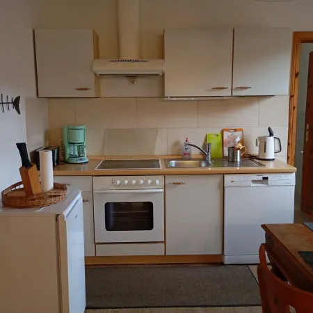 Vacation apartment near the national park and harbor with terrace and parking space